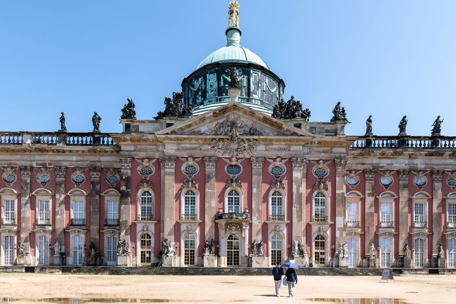 Explore the stunning baroque facade of Sanssouci Palace, a historical landmark in Potsdam, Germany.
