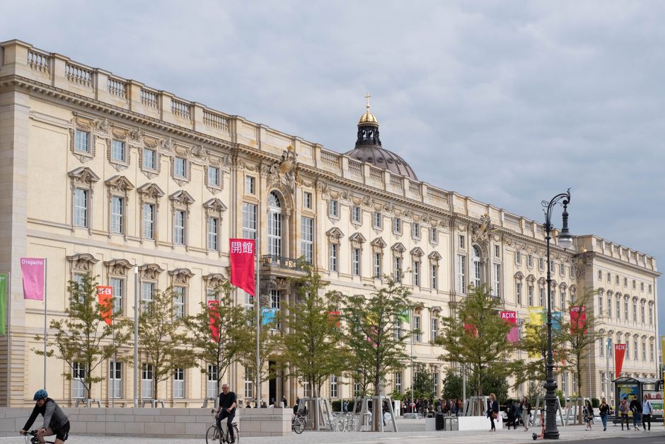 Facade of the historic Berlin Palace on a cloudy day, showcasing its architecture.